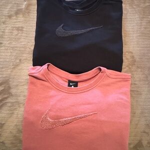 Black and pink cropped crew neck sweaters